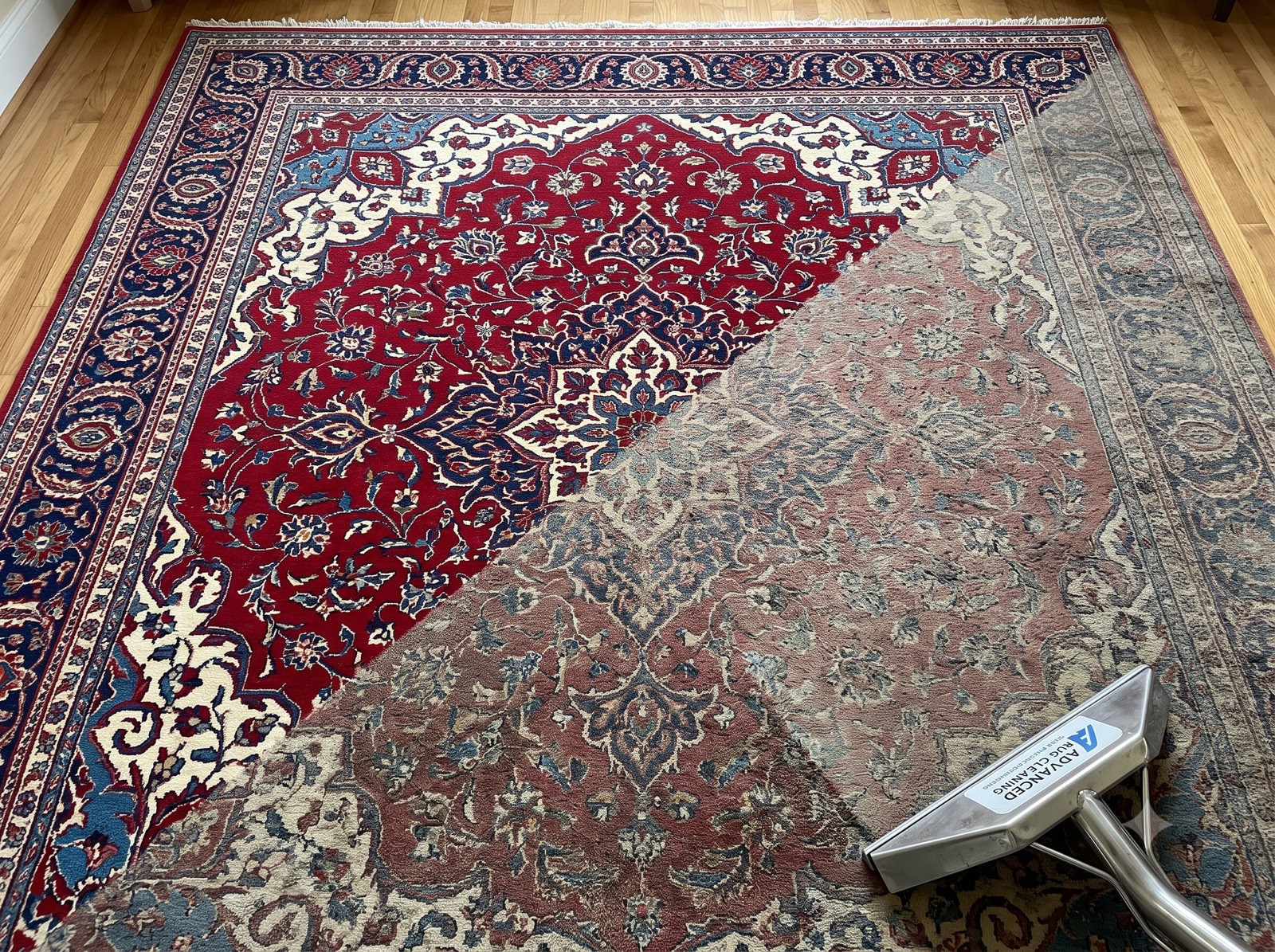 Oriental area rug half cleaned, showing vivid restored colors
